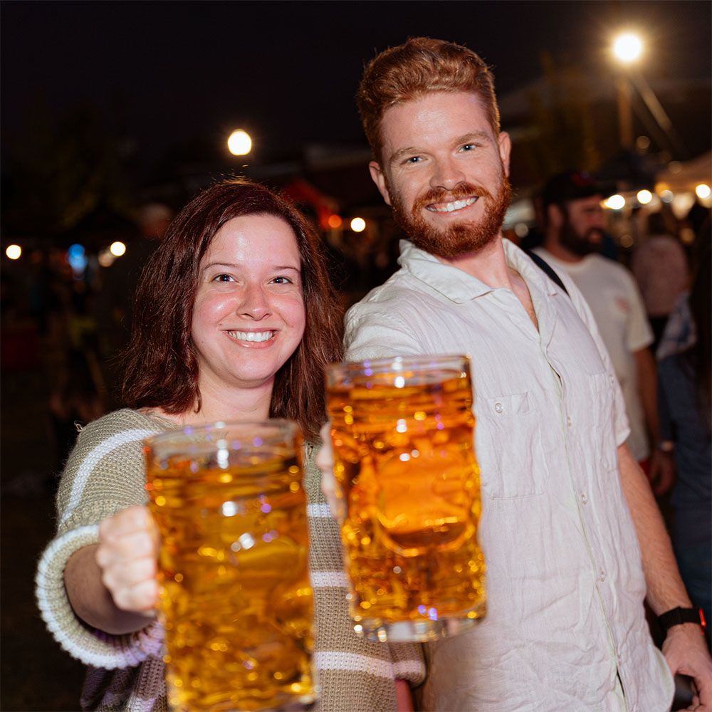 Barrels and Brews couple holding steins